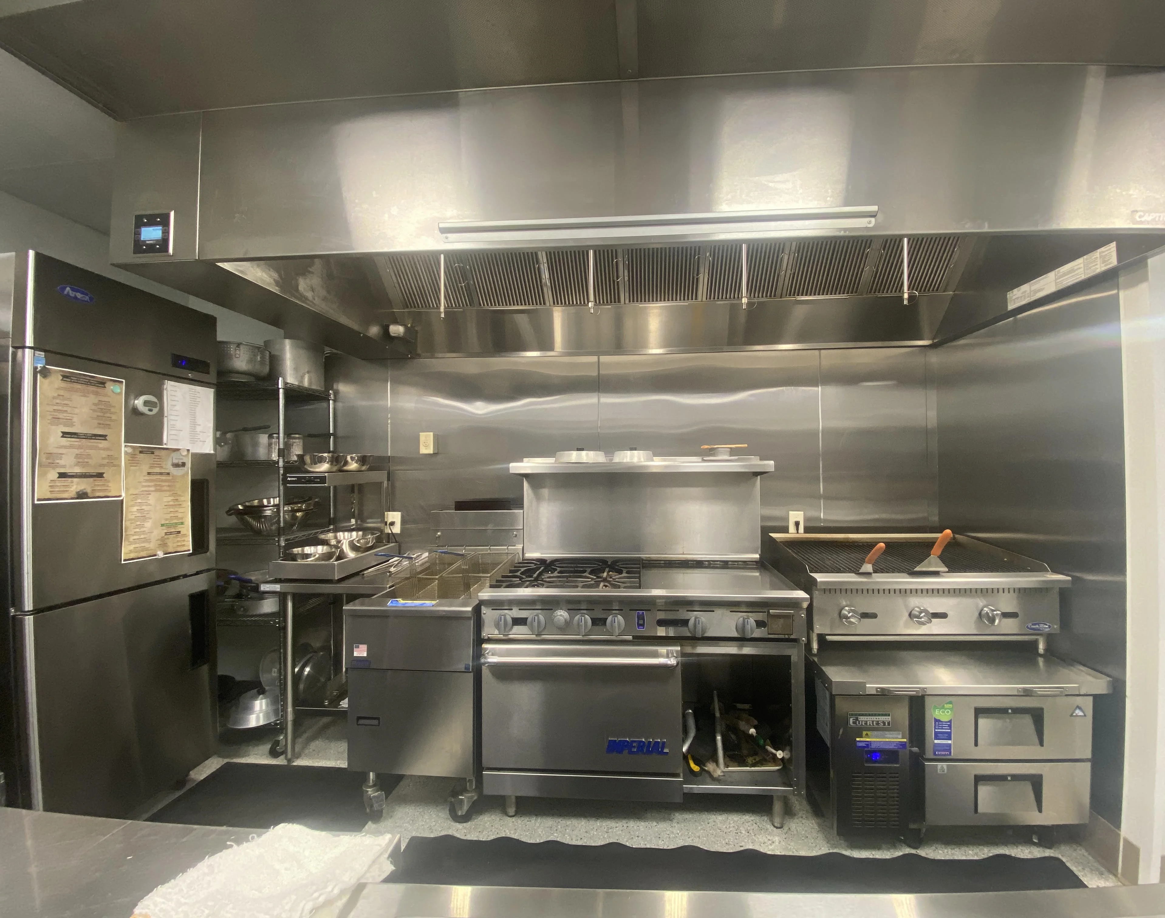 Modern commercial kitchen with stainless steel appliances