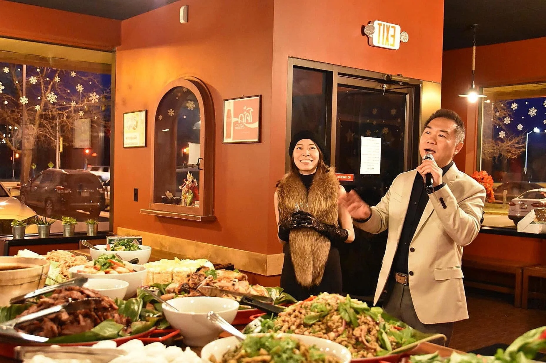 Cozy restaurant interior with a buffet of Asian dishes