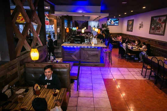 Cozy restaurant interior with warm lighting and wooden decor