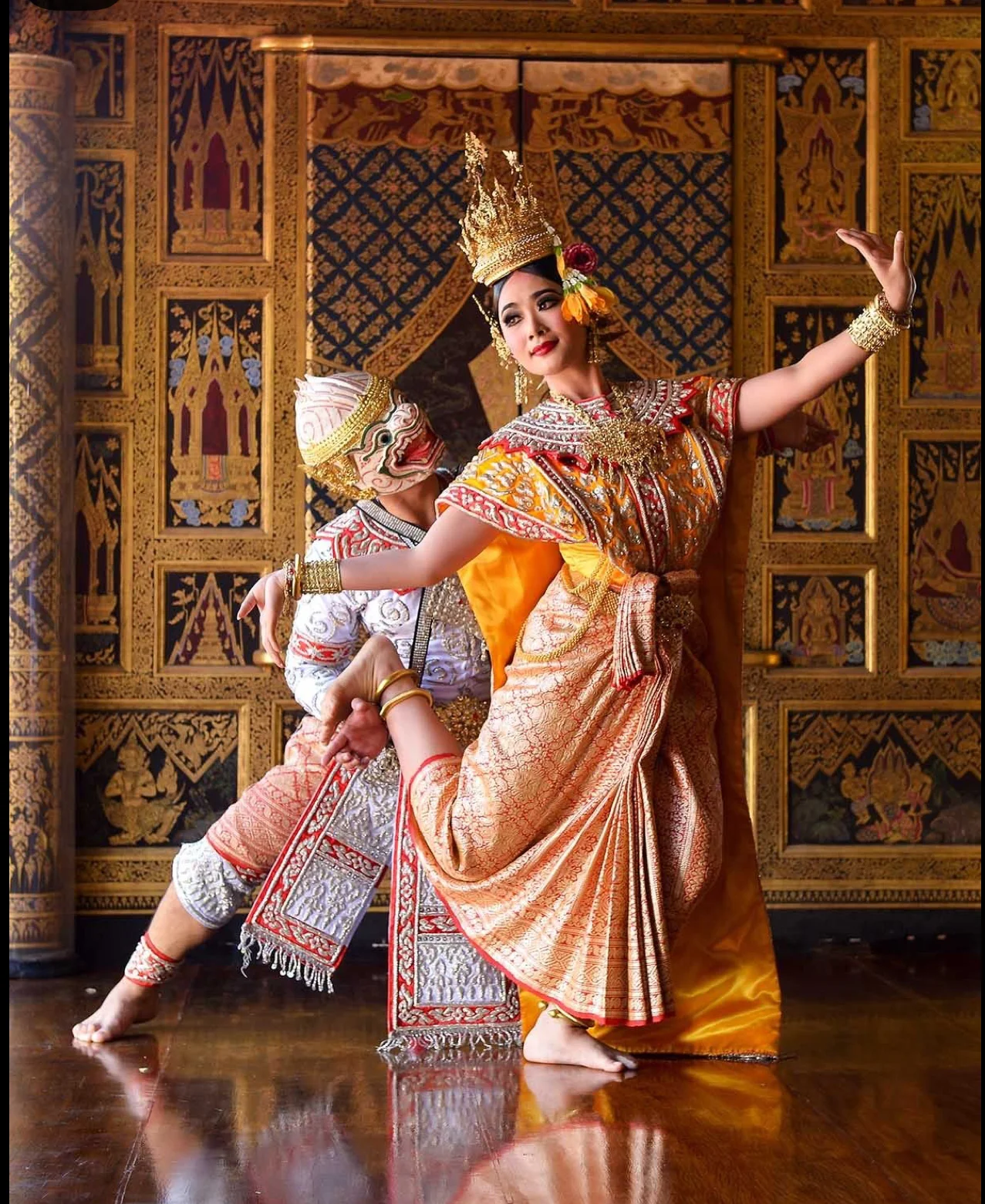 Traditional Thai dance performance with ornate costumes