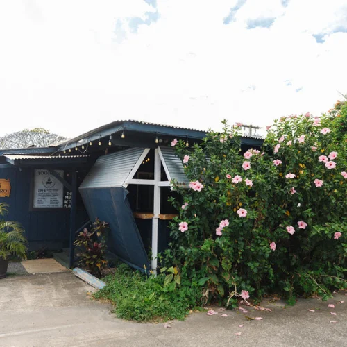 Charming restaurant exterior with vibrant flowers