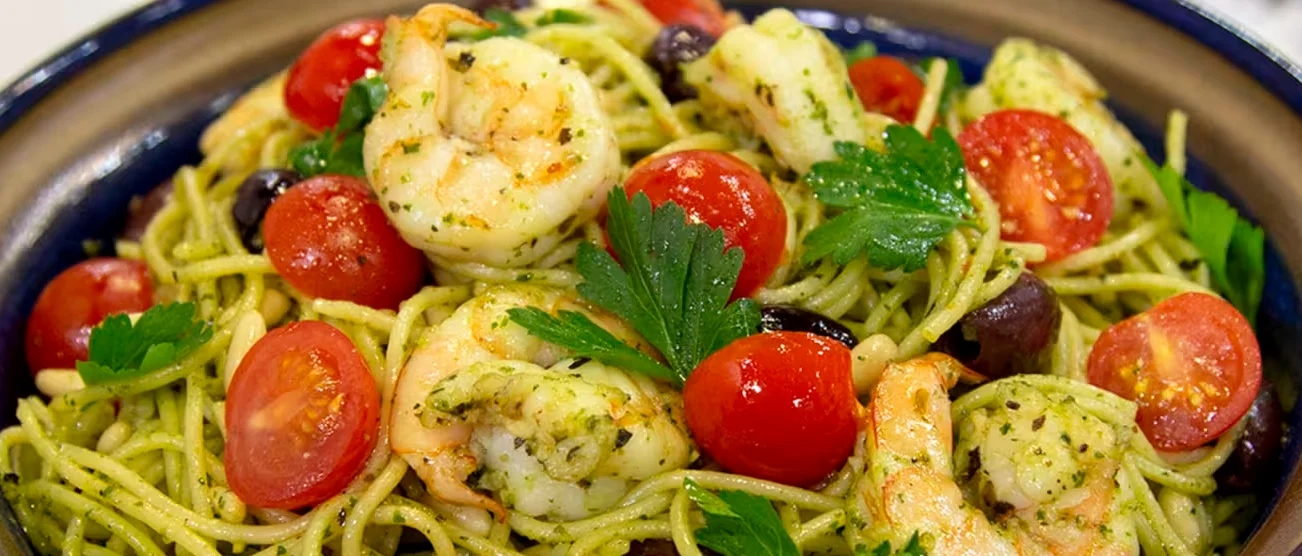 Shrimp pesto pasta with cherry tomatoes