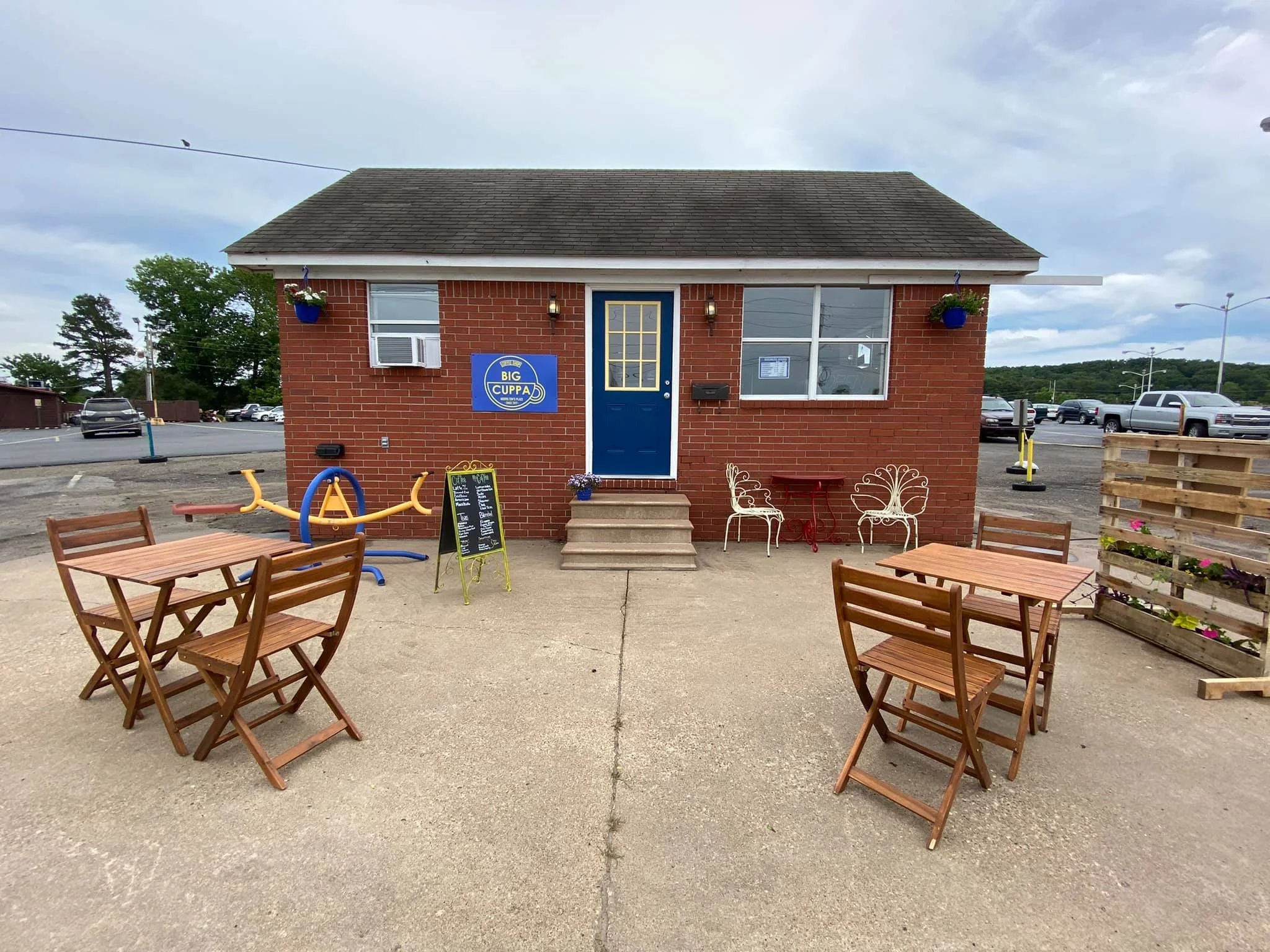 Charming café exterior with outdoor seating and colorful decor