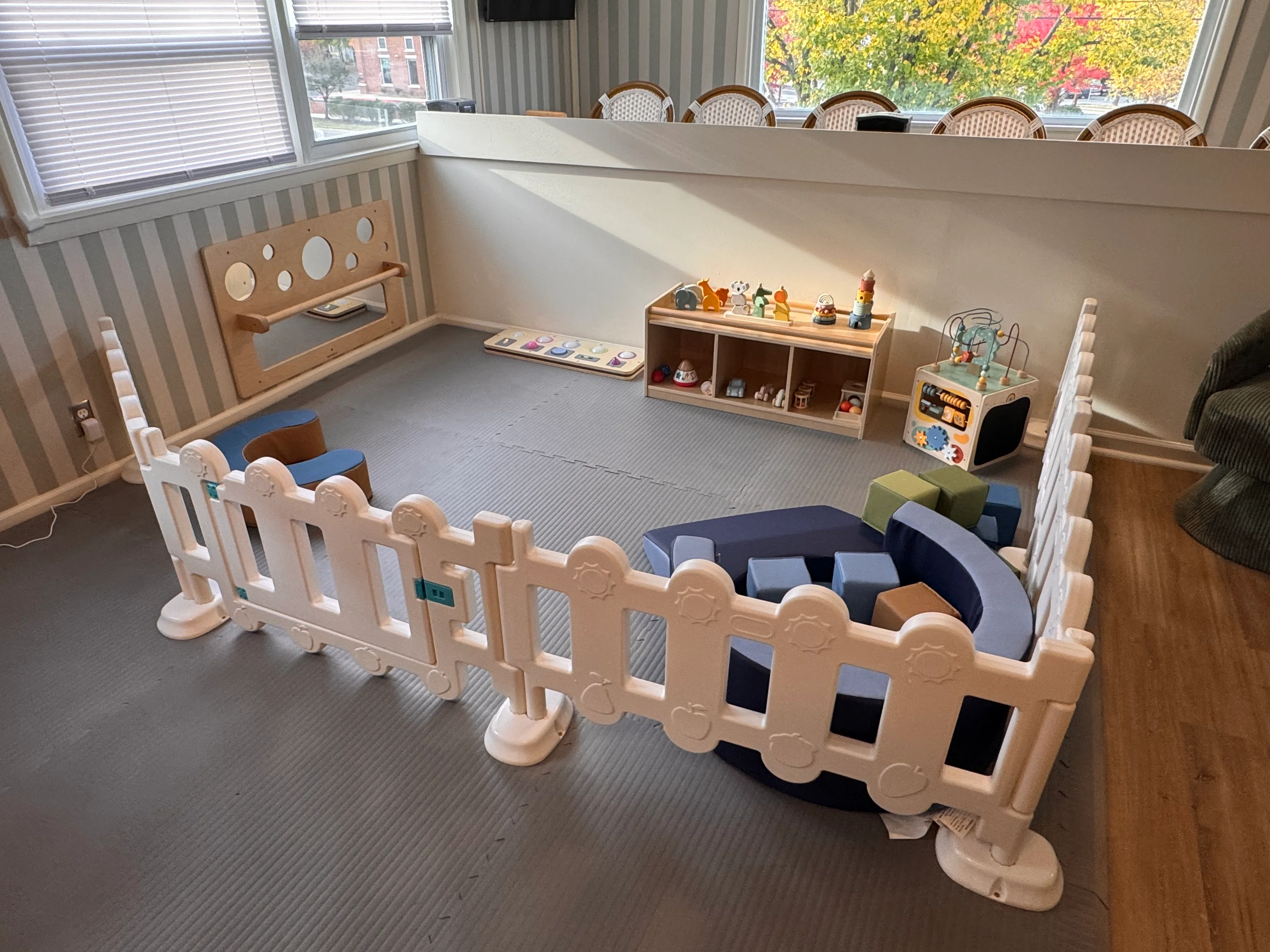 Child-friendly play area with colorful toys and soft seating