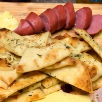 German charcuterie board featuring sausages and cheeses for Oktoberfest celebration