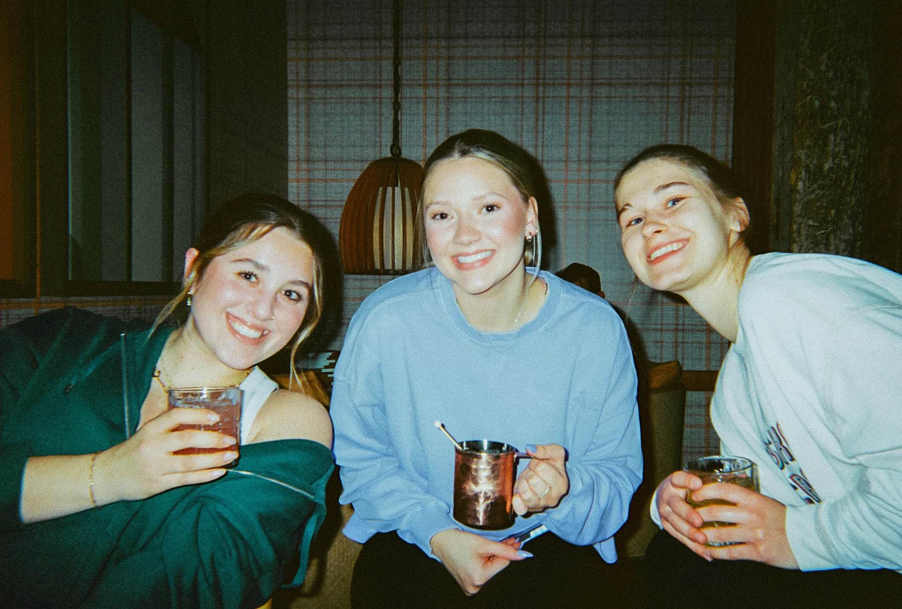 Three friends enjoying drinks 