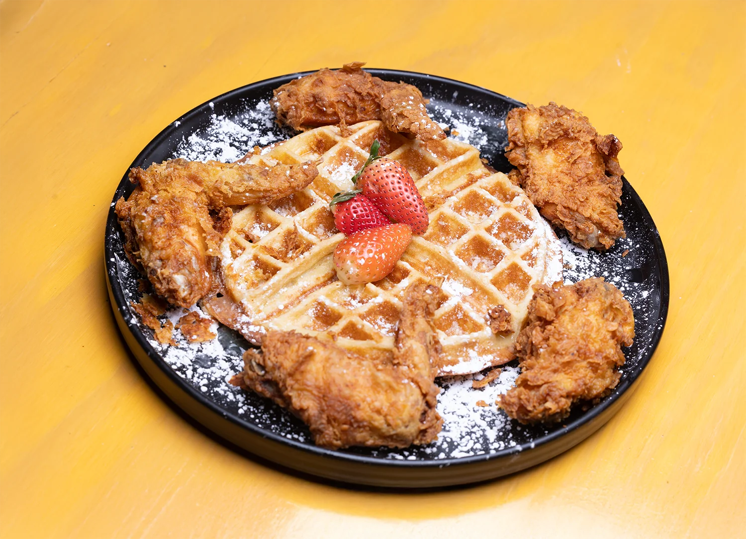 Southern chicken and waffles with strawberries