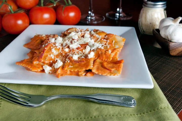 Delicious baked pasta dish topped with melted cheese and herbs.