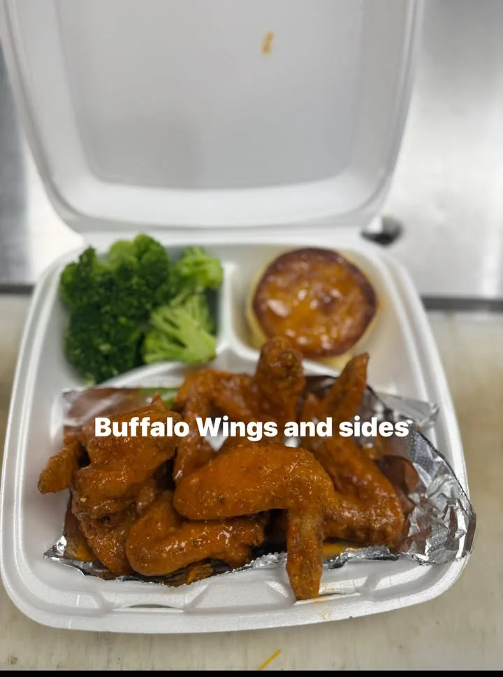 Buffalo wings served with broccoli and dipping sauce