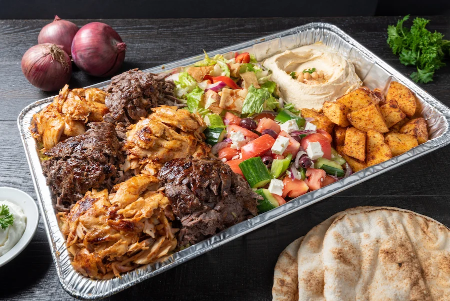 Mediterranean platter with shawarma, salad, and hummus