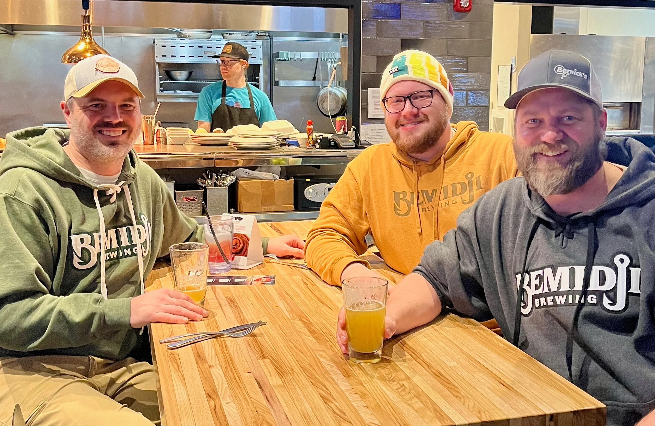 Friends enjoying craft beer at a cozy brewery