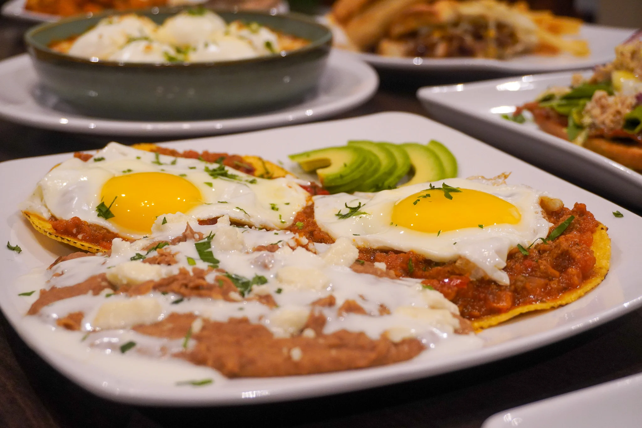 Huevos rancheros served with fried eggs and refried beans