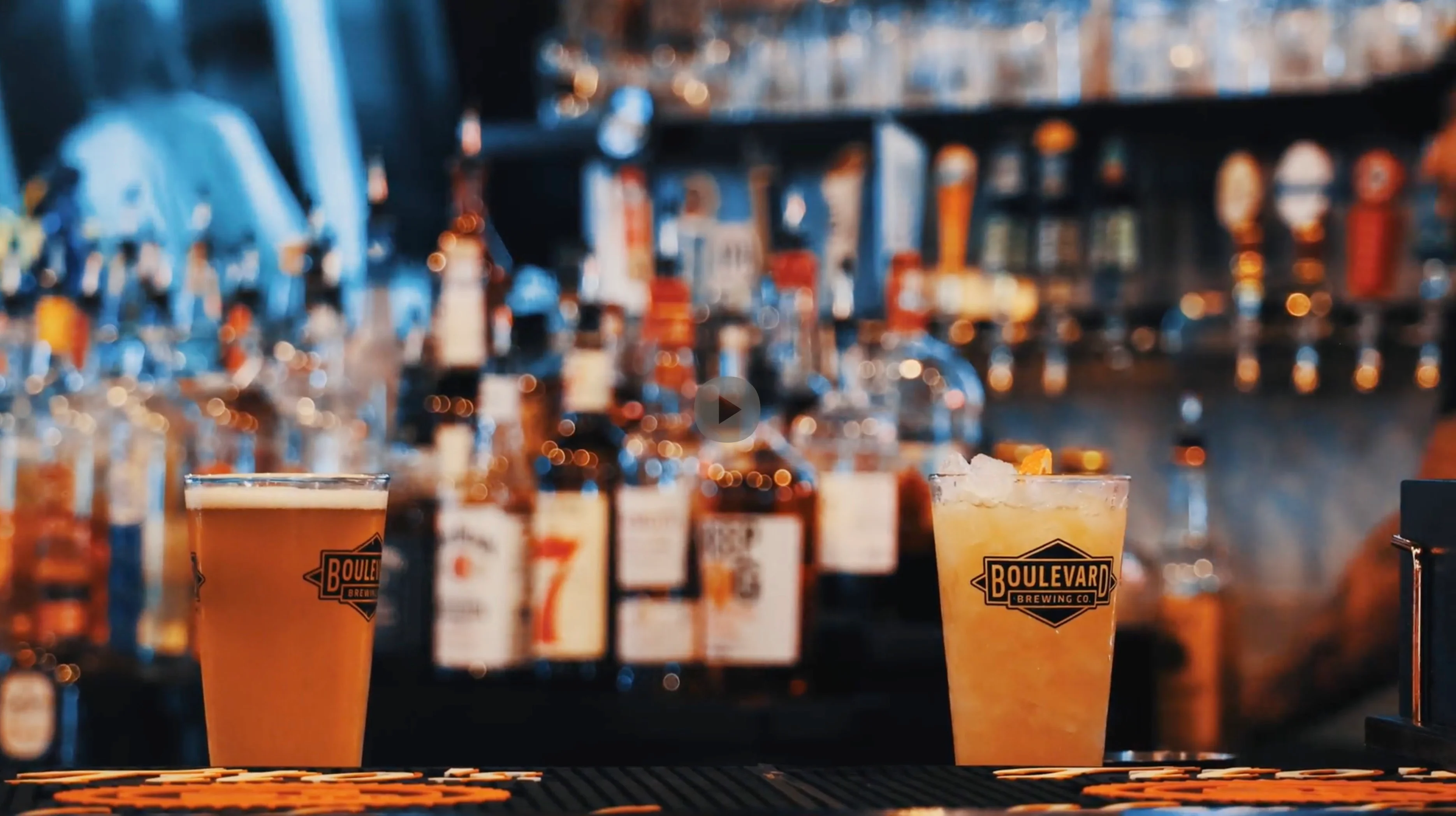 Craft cocktails at a vibrant bar with a variety of spirits