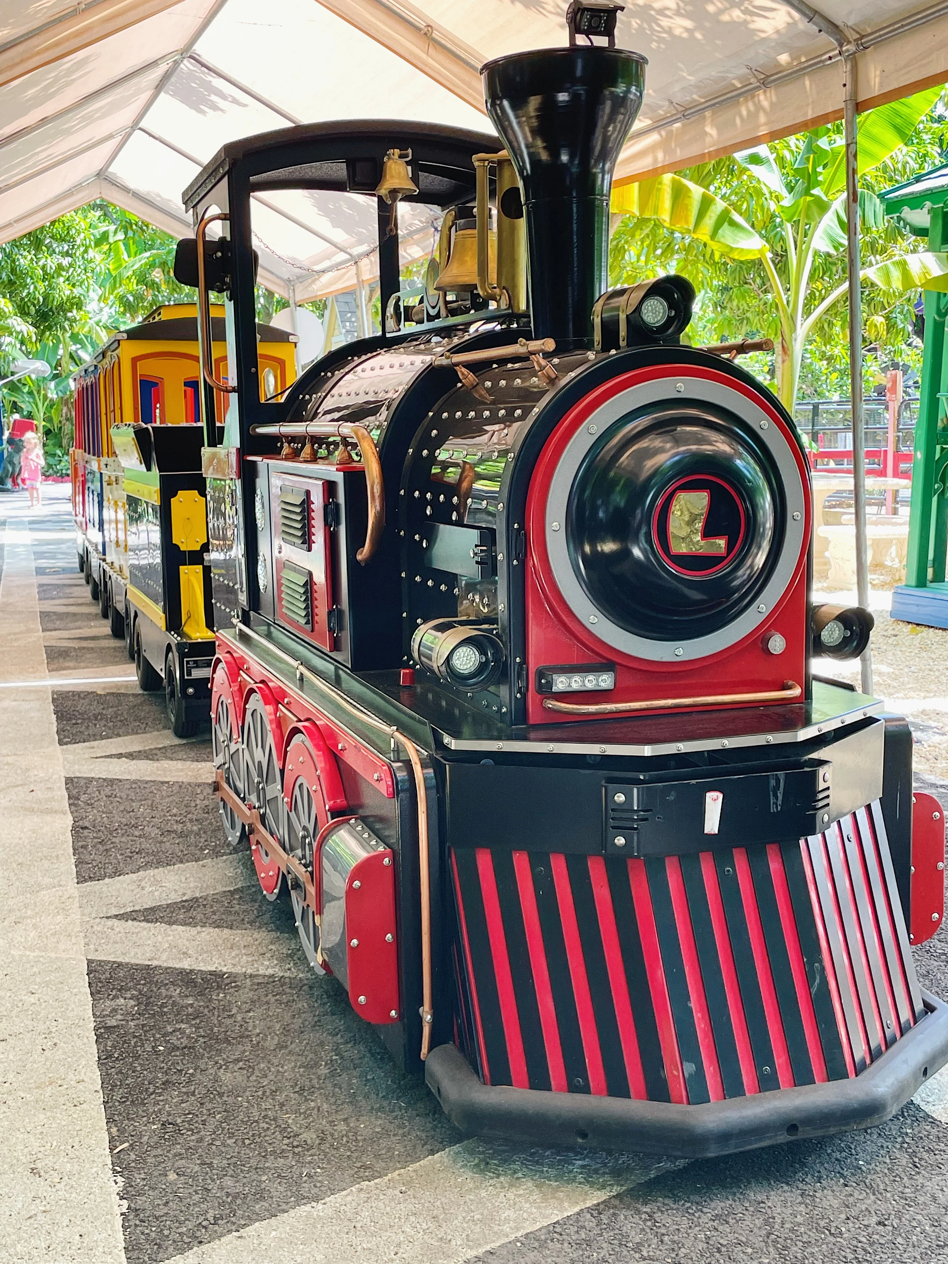 Colorful miniature train in a festive outdoor setting