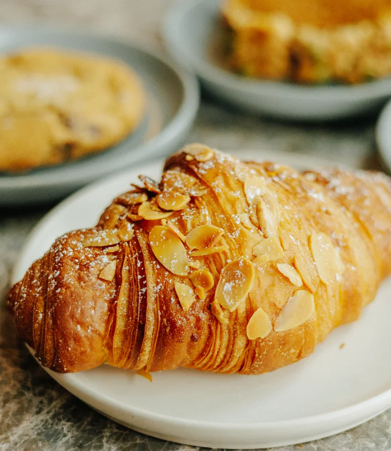 Almond croissant on a white plate