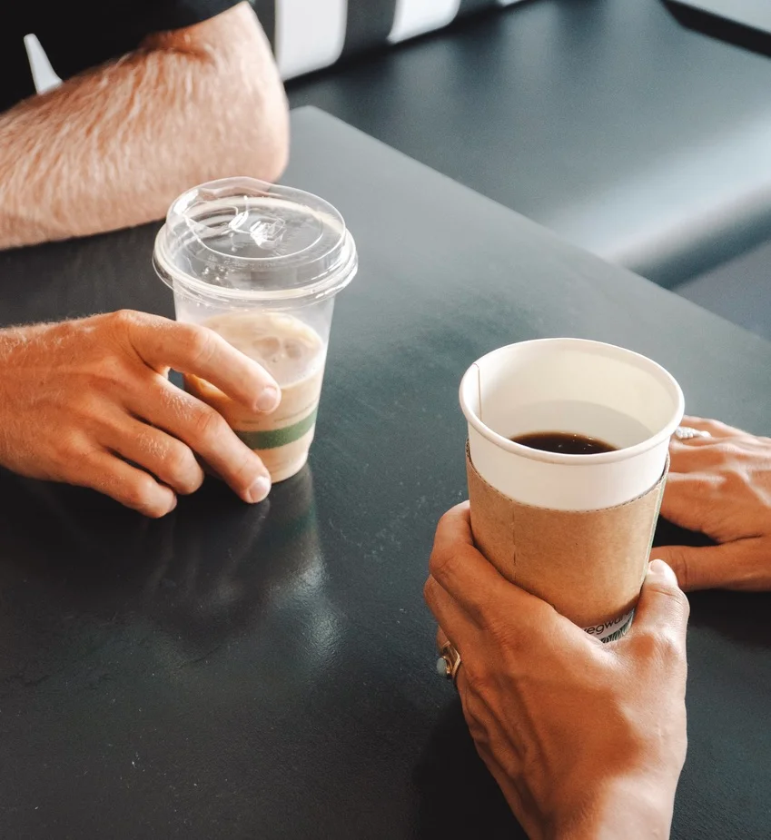 A couple enjoying the hot and cold drinks