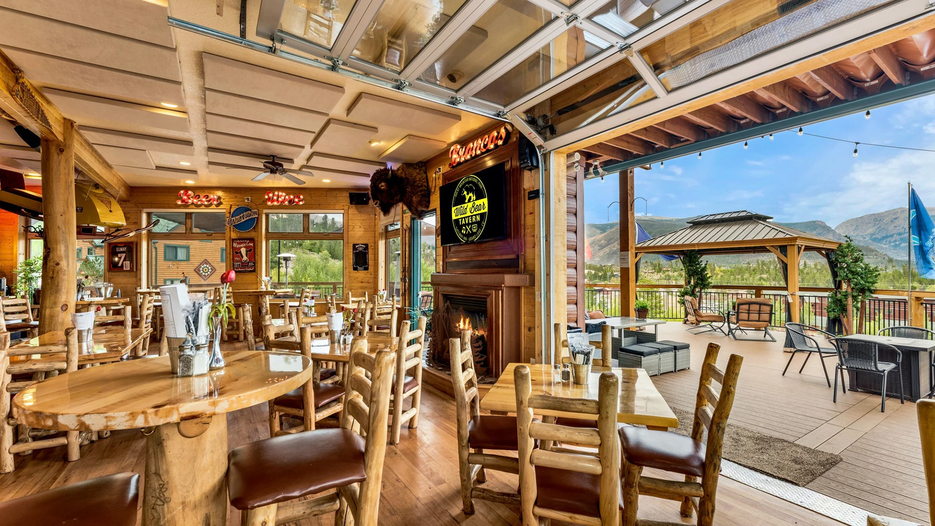 Cozy restaurant interior with wooden decor and outdoor seating
