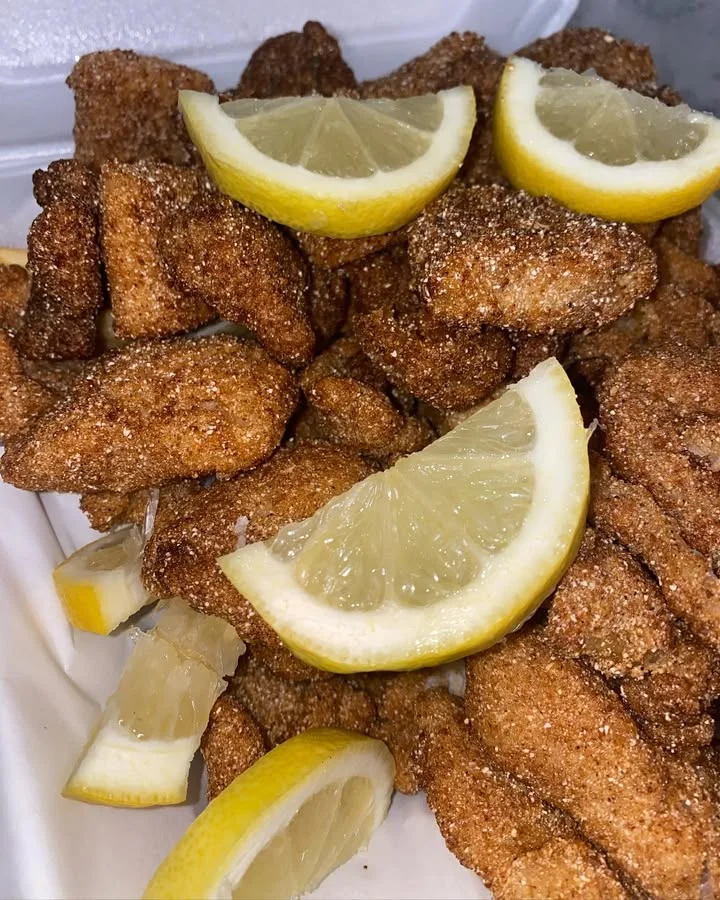 Southern-style fried catfish bites with lemon wedges
