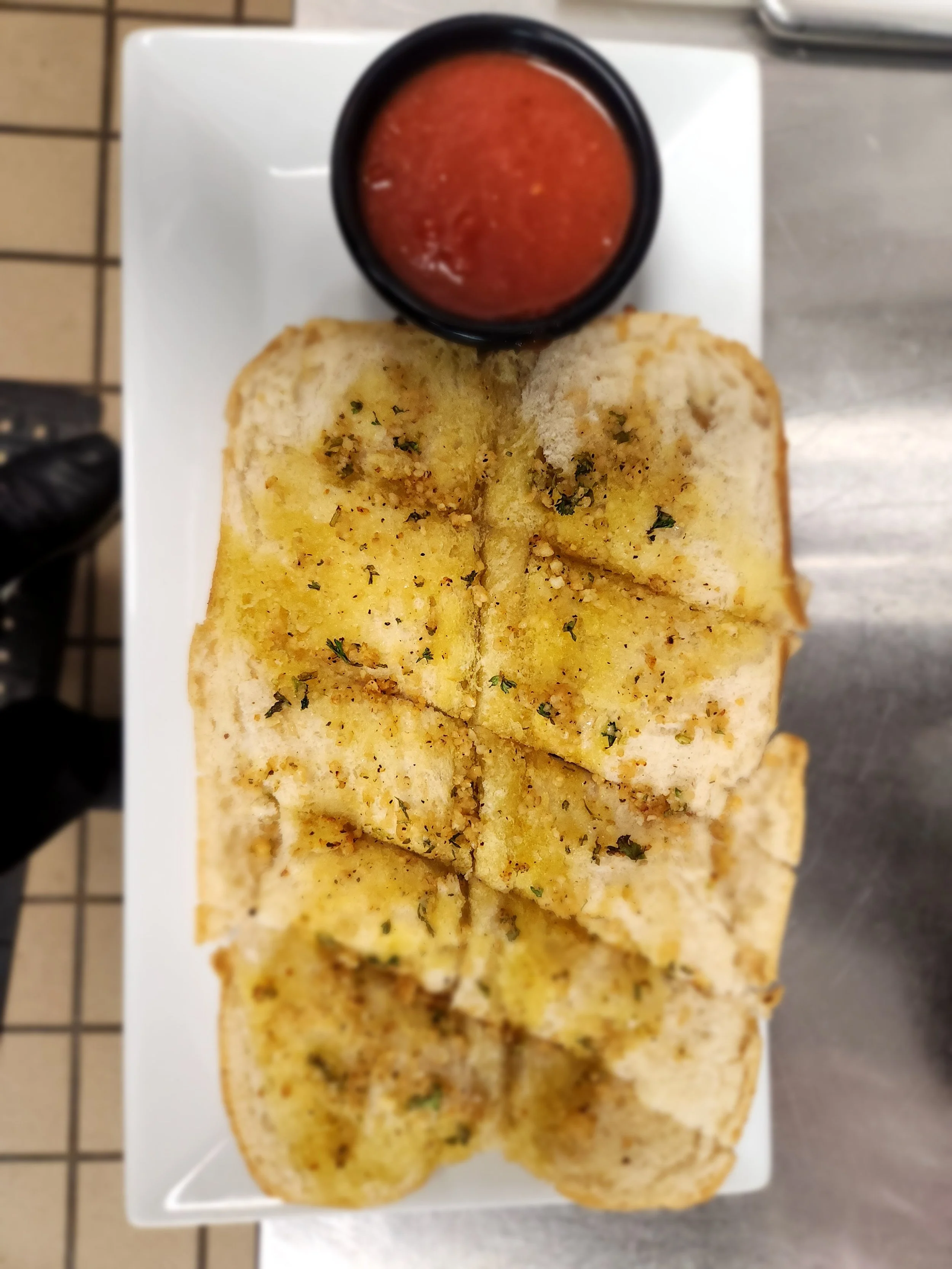 Garlic bread served with marinara sauce