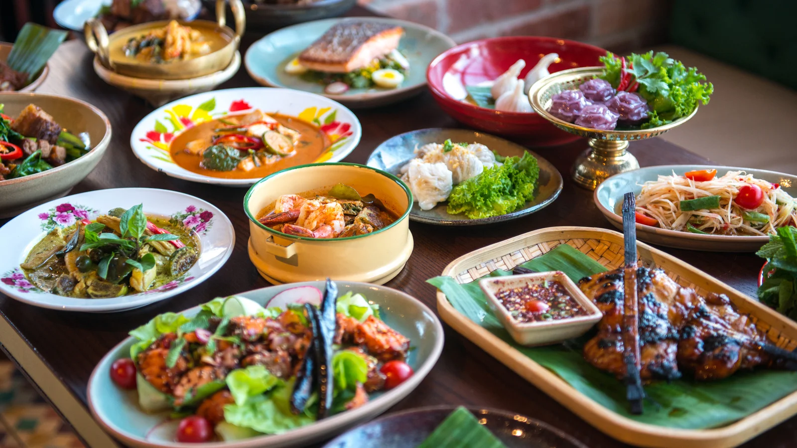 Assorted Thai dishes including green curry and pad thai