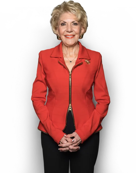 Professional woman in a red blazer posing confidently