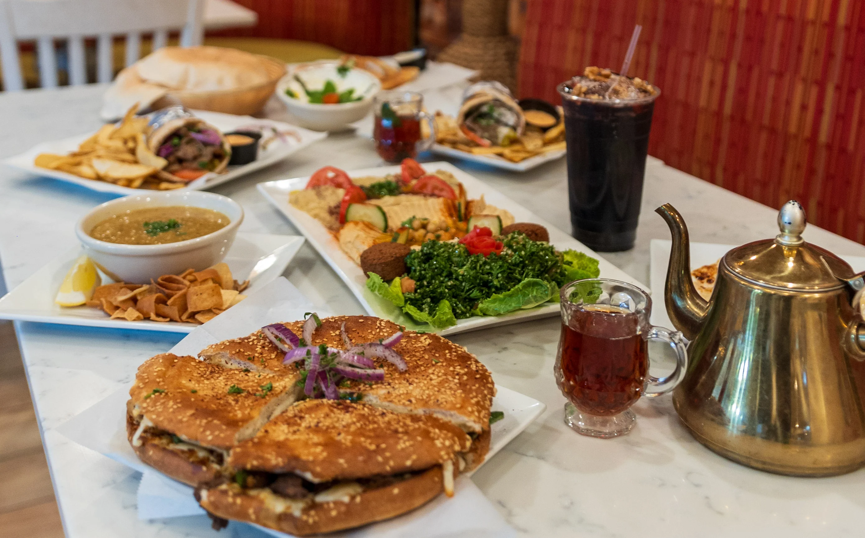 Middle Eastern feast with shawarma, falafel, and tea