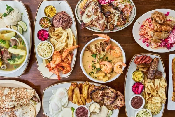 Assorted Caribbean seafood platters with grilled meats and sides