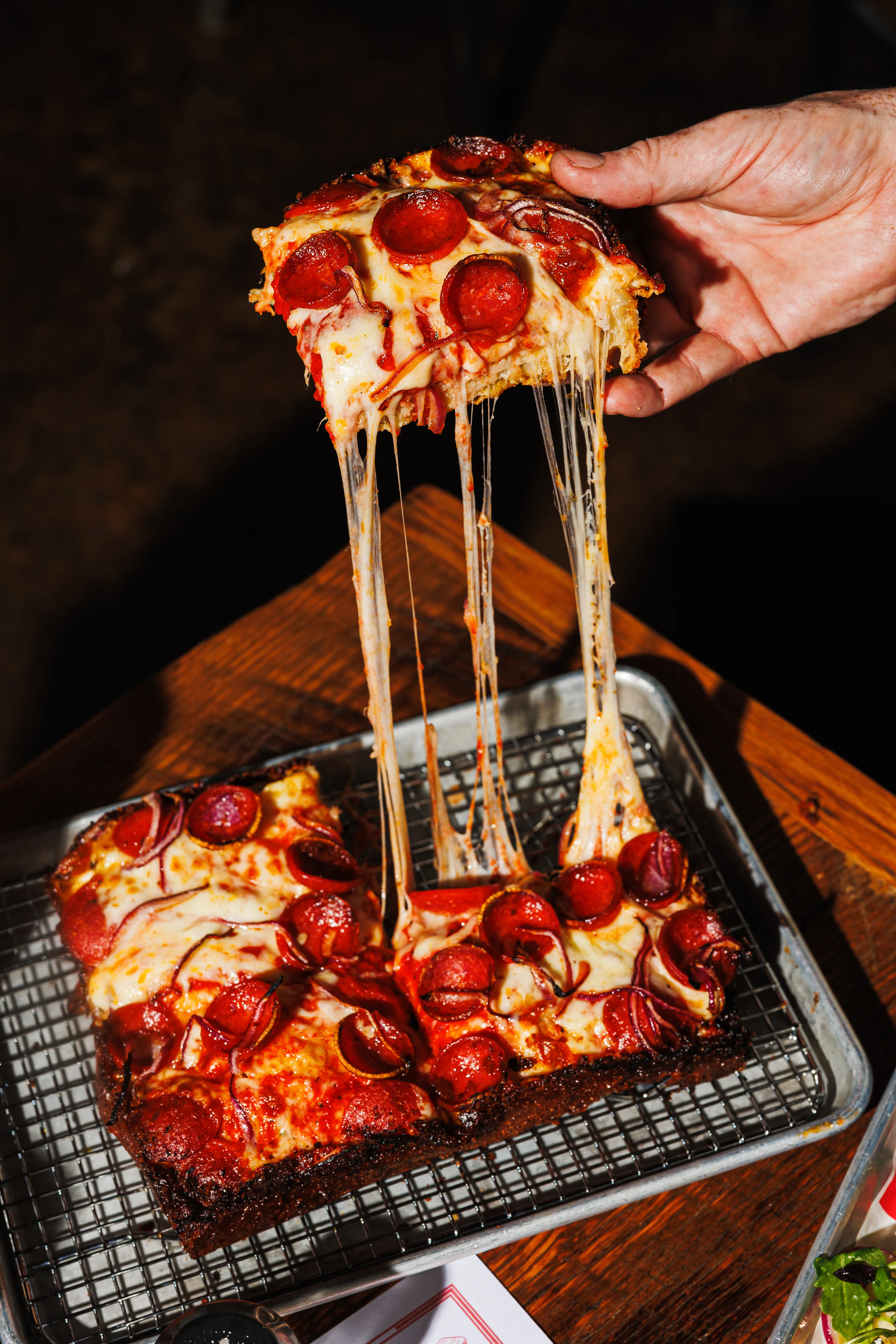 Delicious gourmet burger with fresh toppings on a wooden table