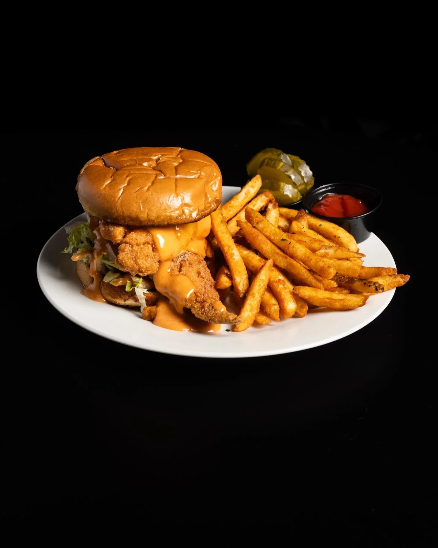 Crispy fried chicken sandwich with fries