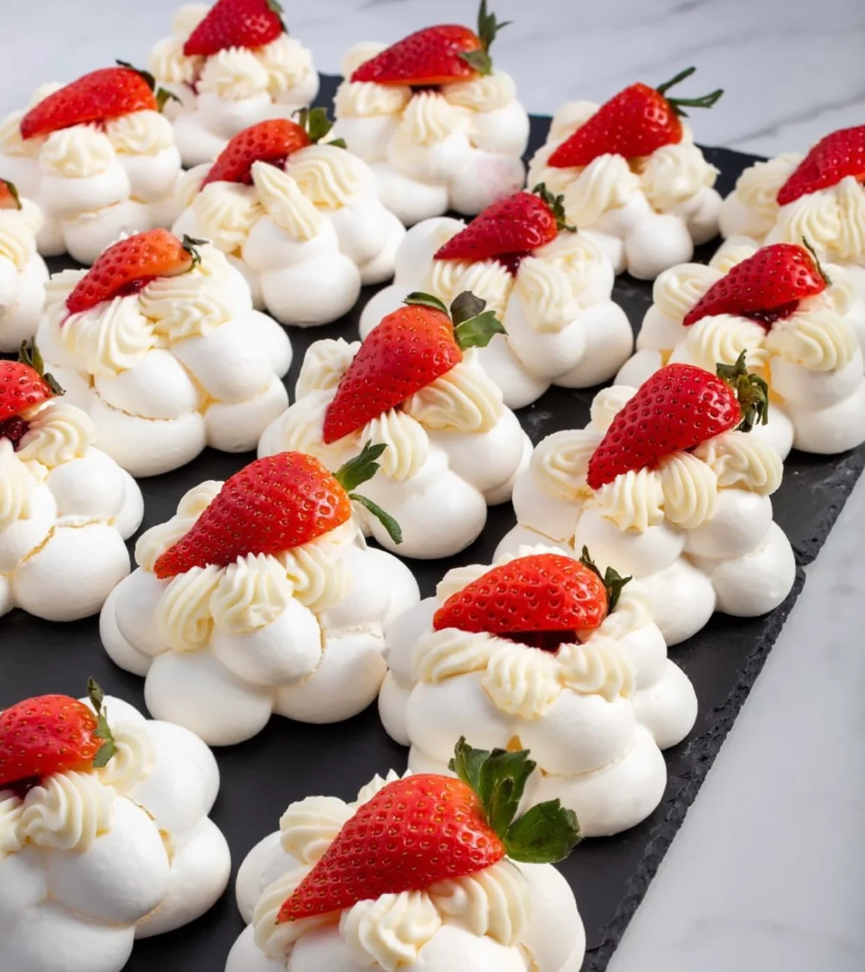 Delicate pavlova topped with fresh strawberries