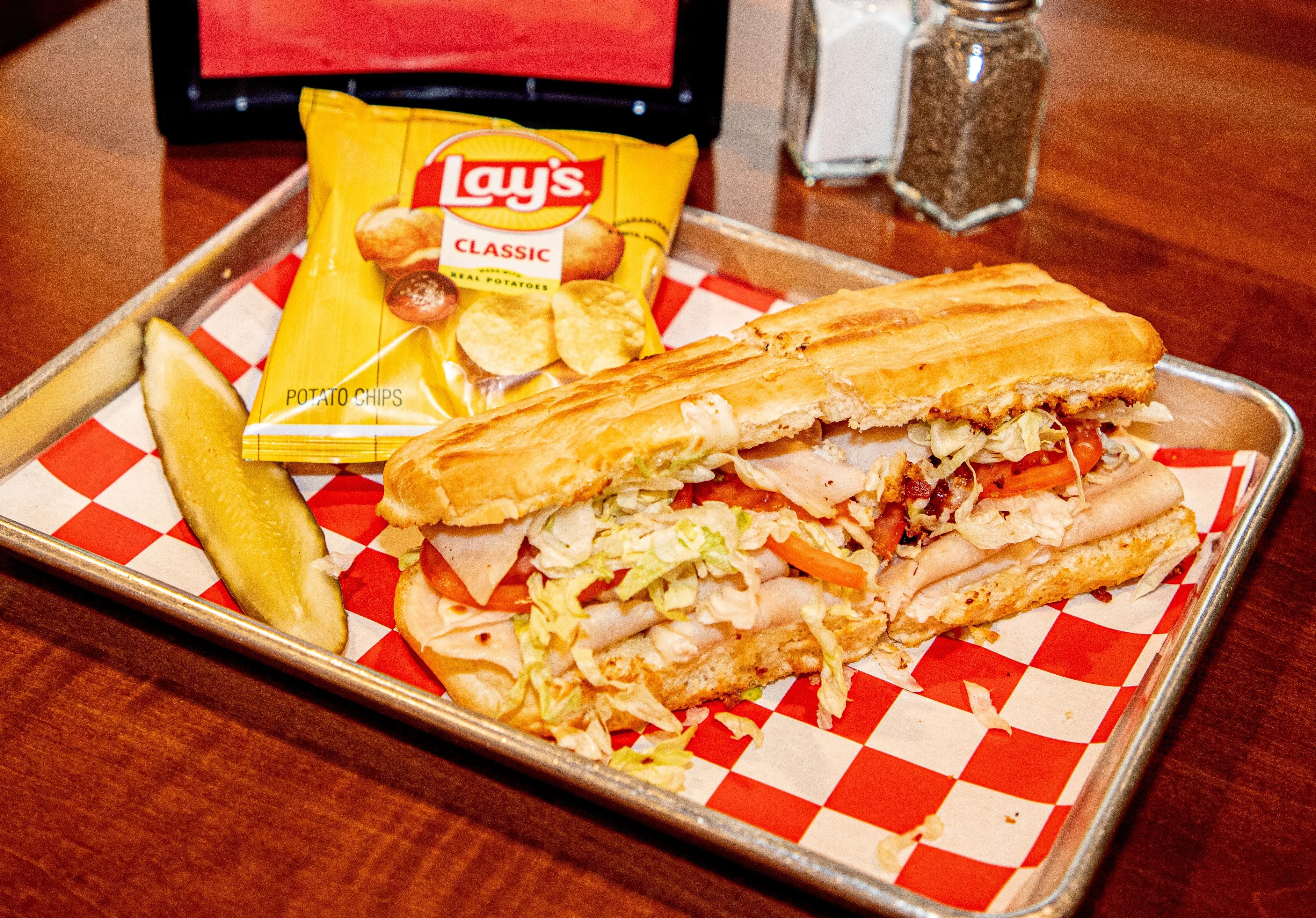Sub sandwich with turkey and fresh toppings served in a casual eatery