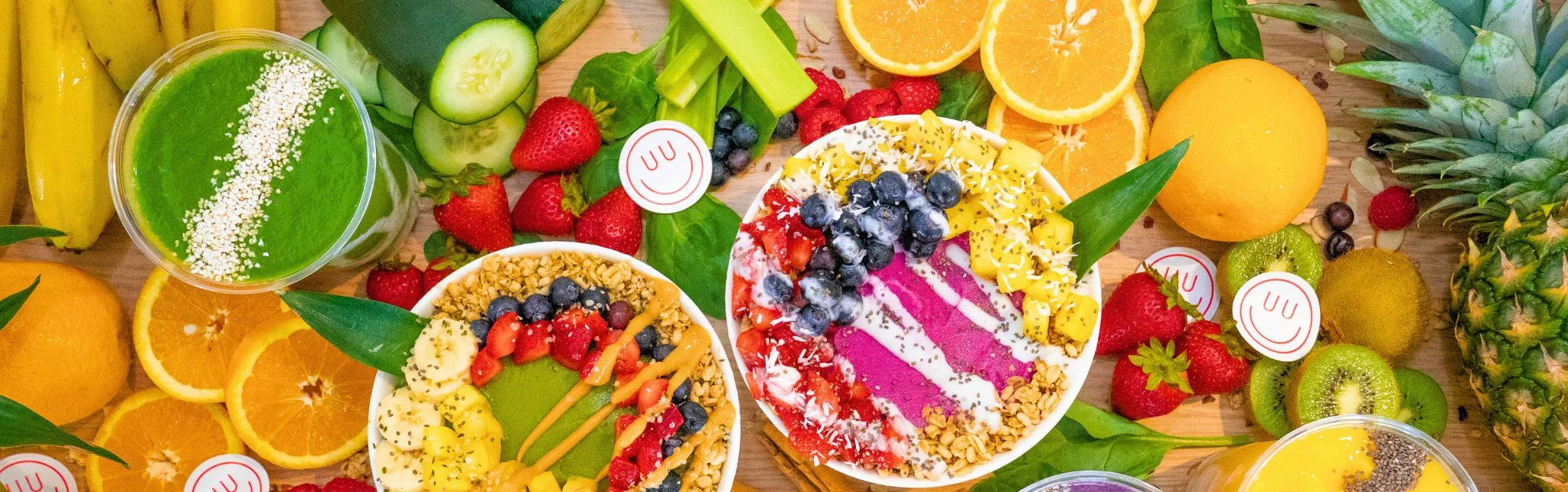 Colorful smoothie bowls with fresh fruits and granola