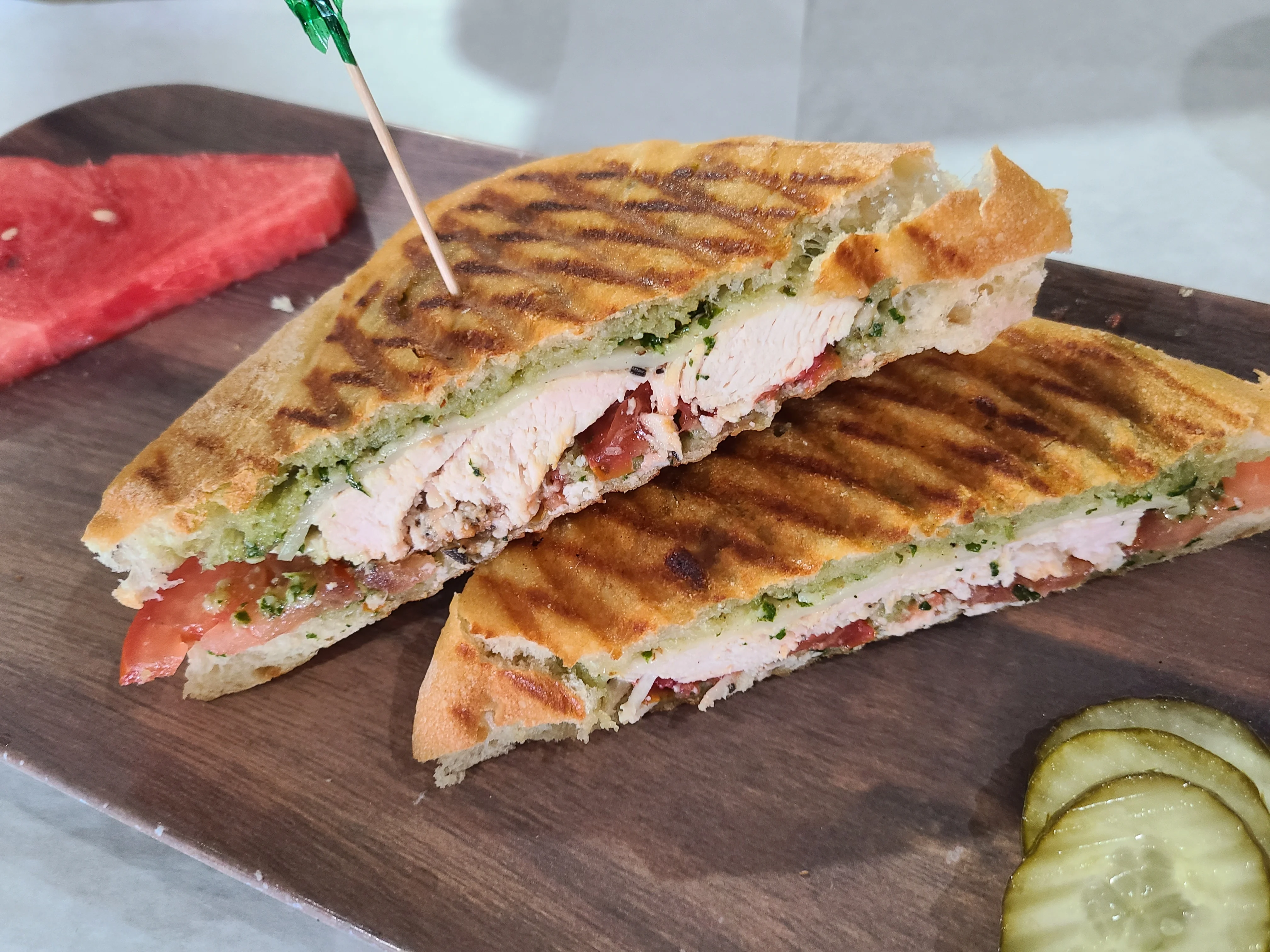 Grilled chicken panini with pesto and tomatoes