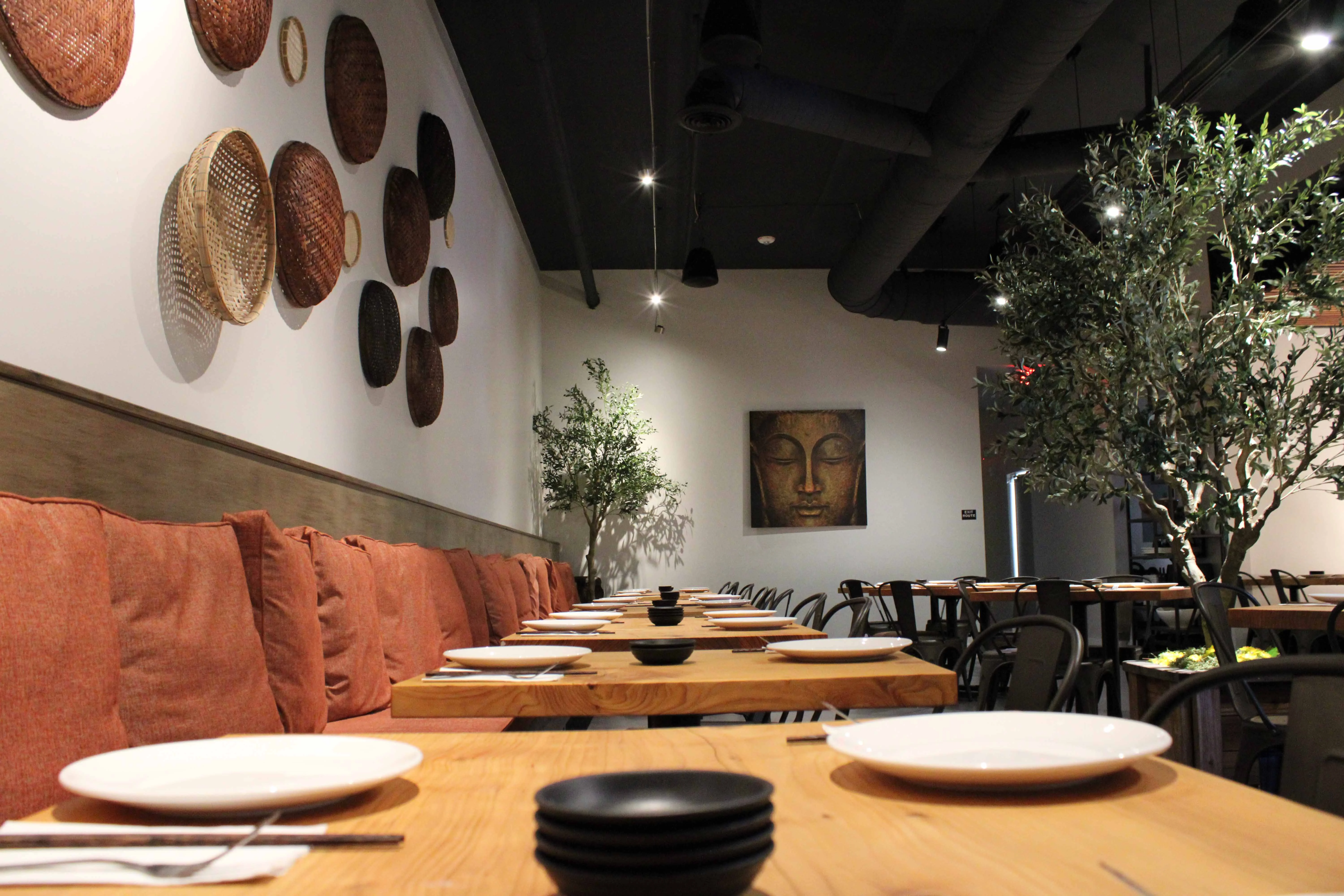 Cozy restaurant interior with warm seating and decorative wall art
