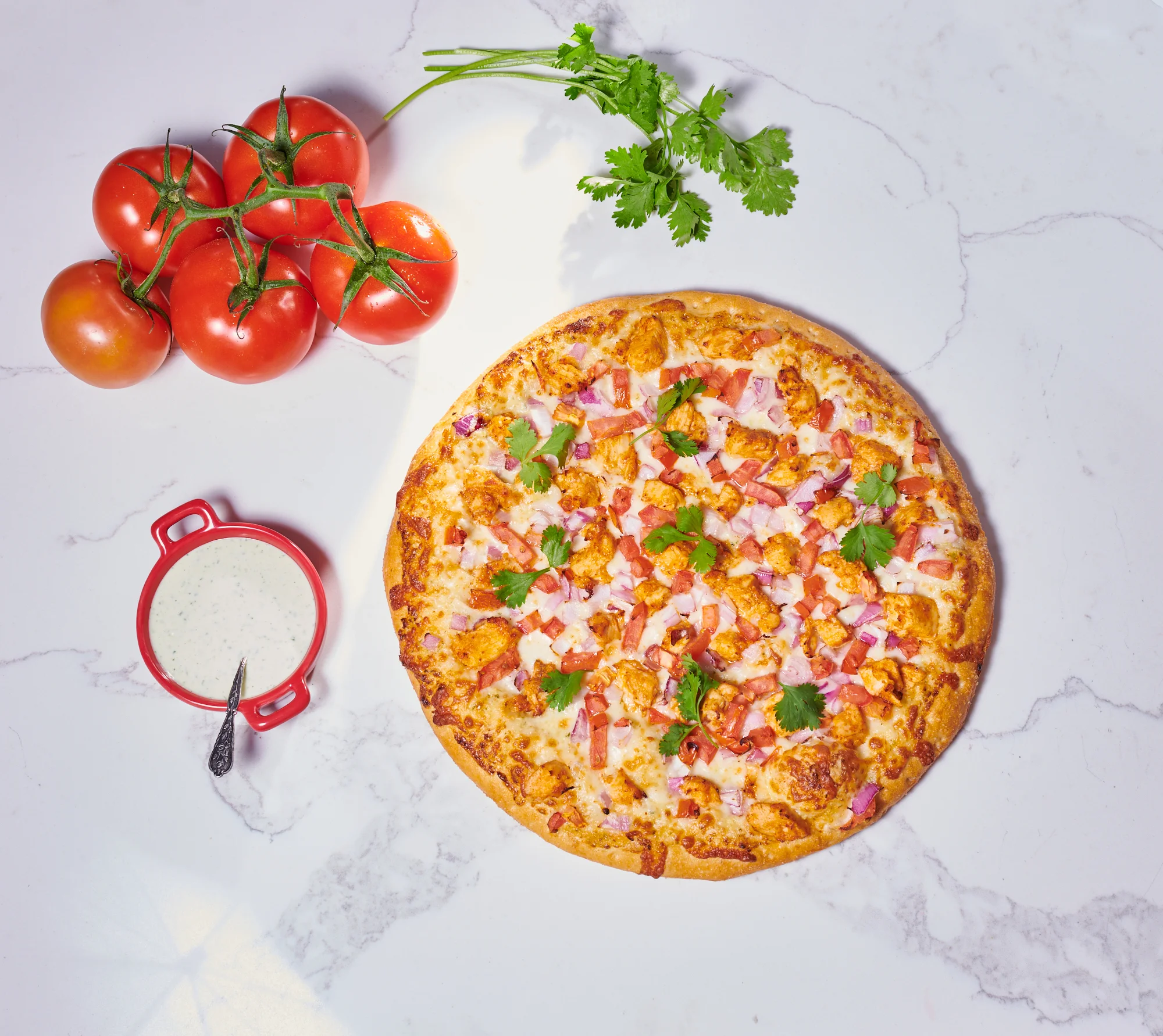 Spicy chicken pizza topped with fresh cilantro