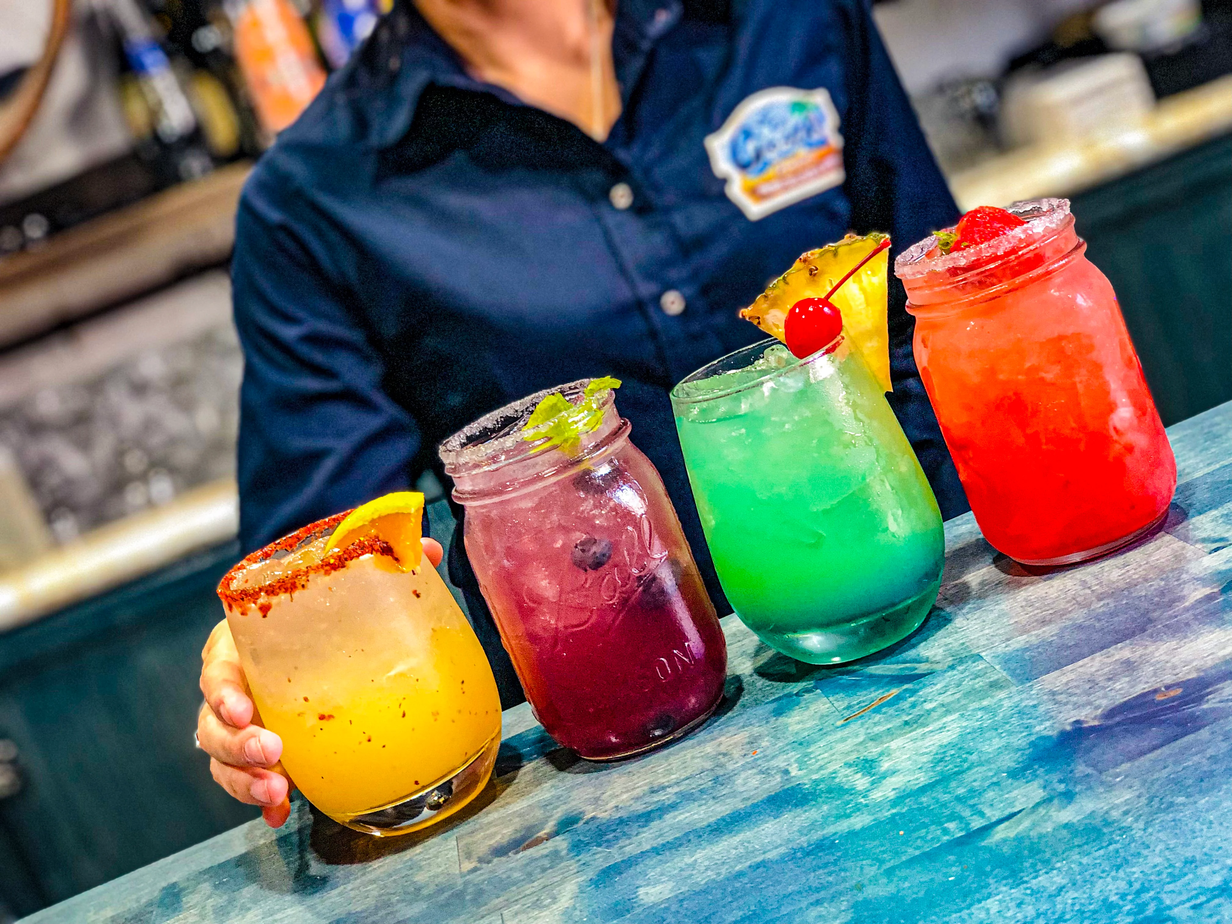 Colorful cocktails served at a vibrant bar
