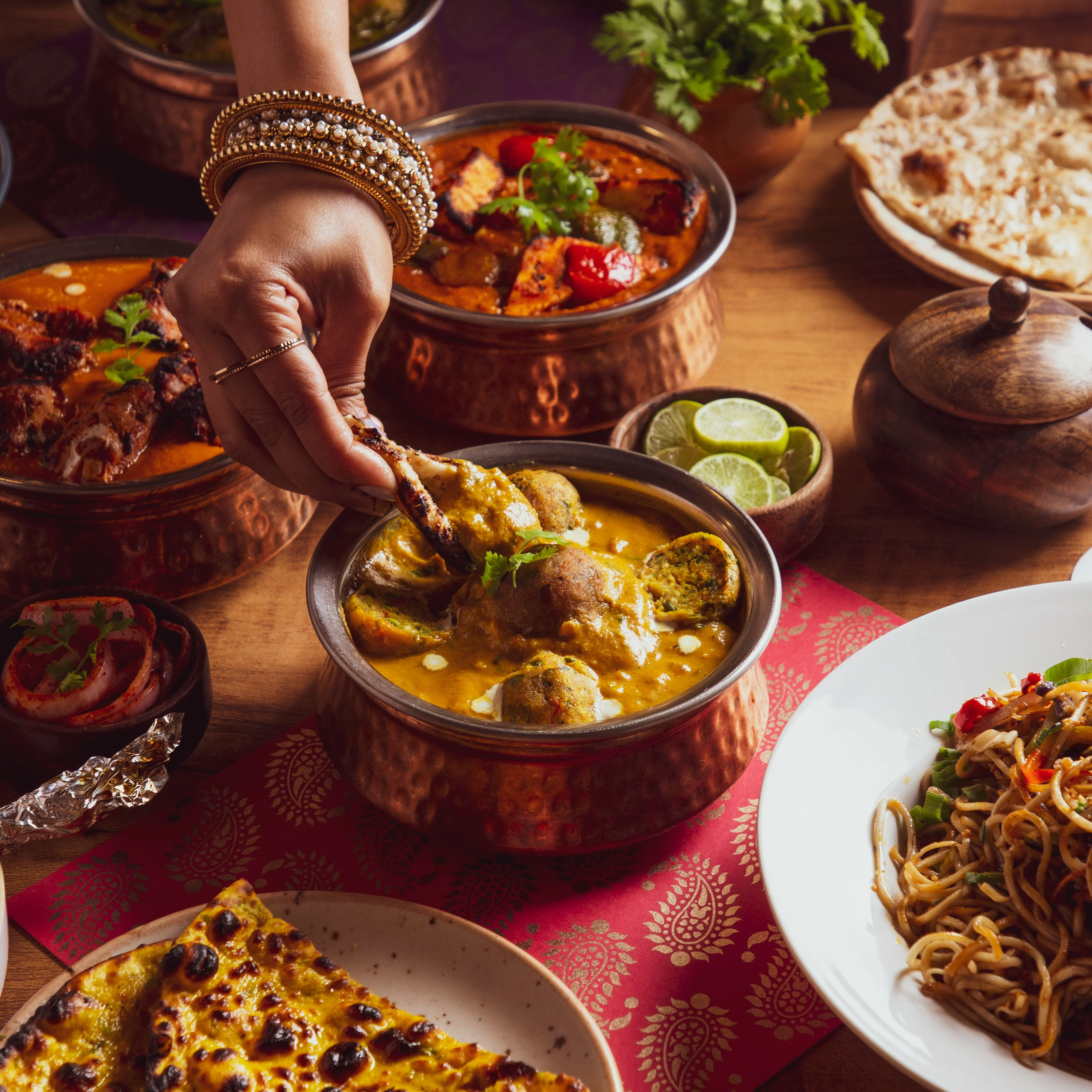 Menu from Tulsi restaurant featuring starters, entrees, and desserts.
