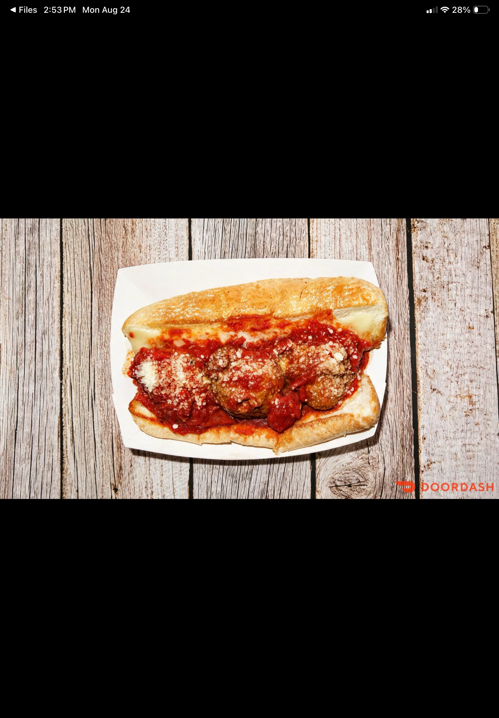 Italian meatball sub with marinara sauce and grated cheese