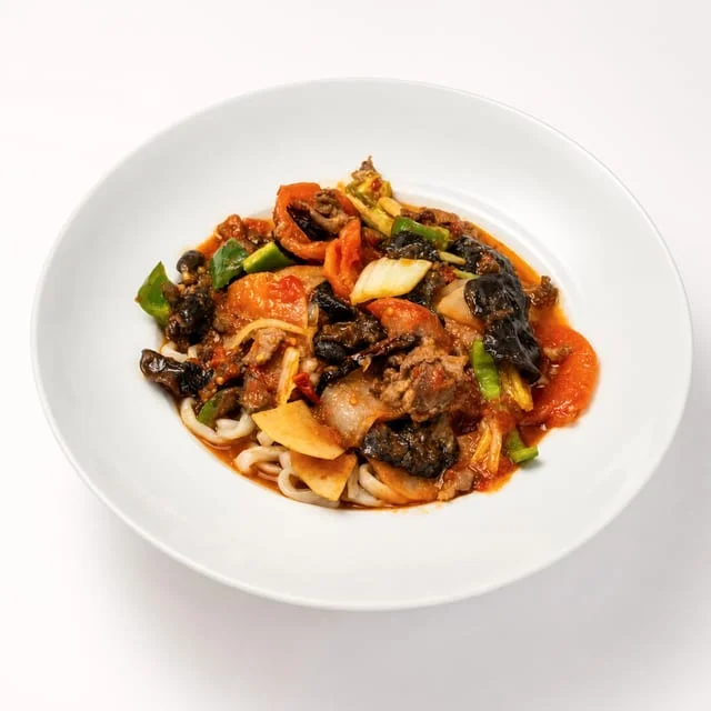 Chinese stir-fried noodles with vegetables and savory sauce