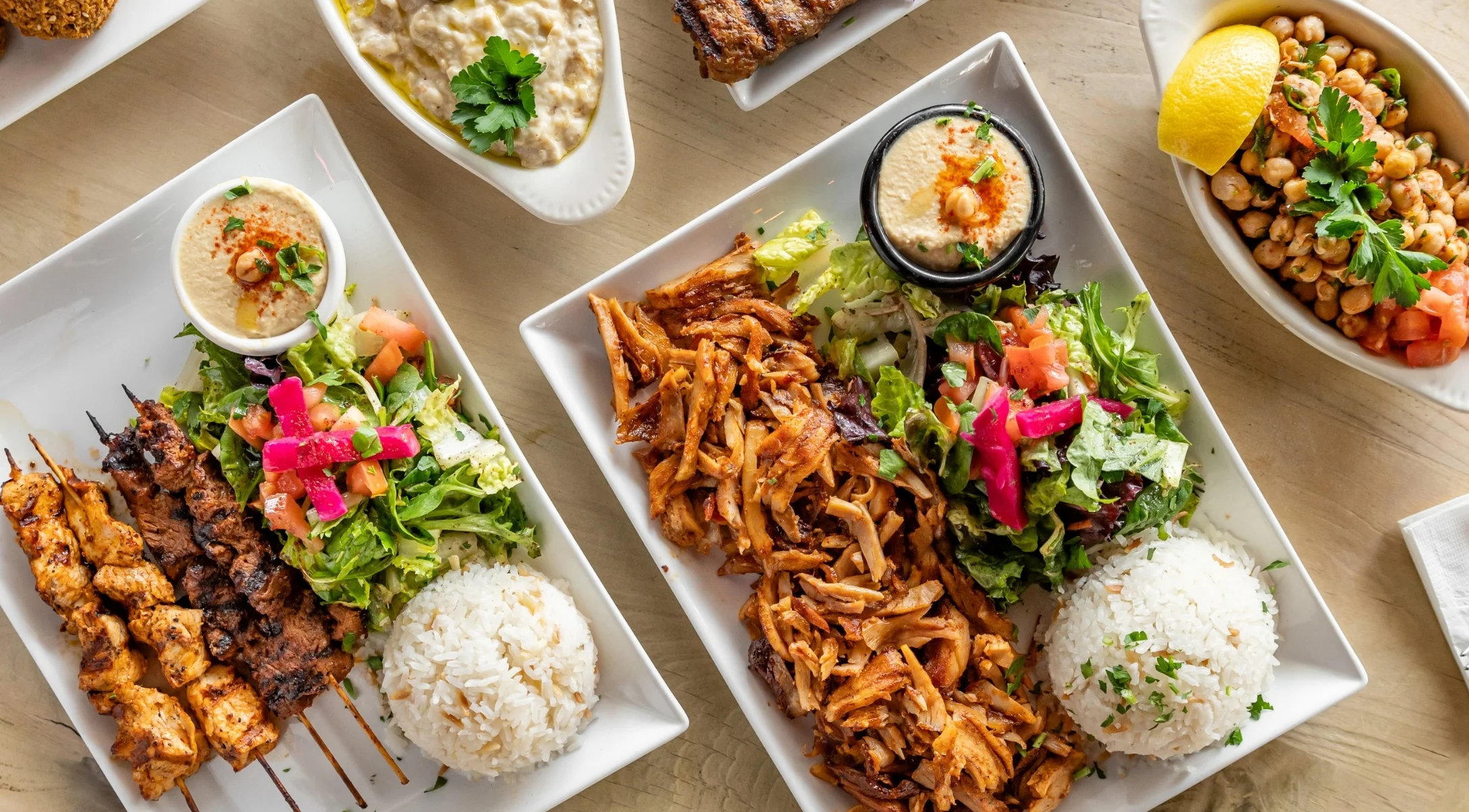 Middle Eastern mixed grill platter with kebabs and rice