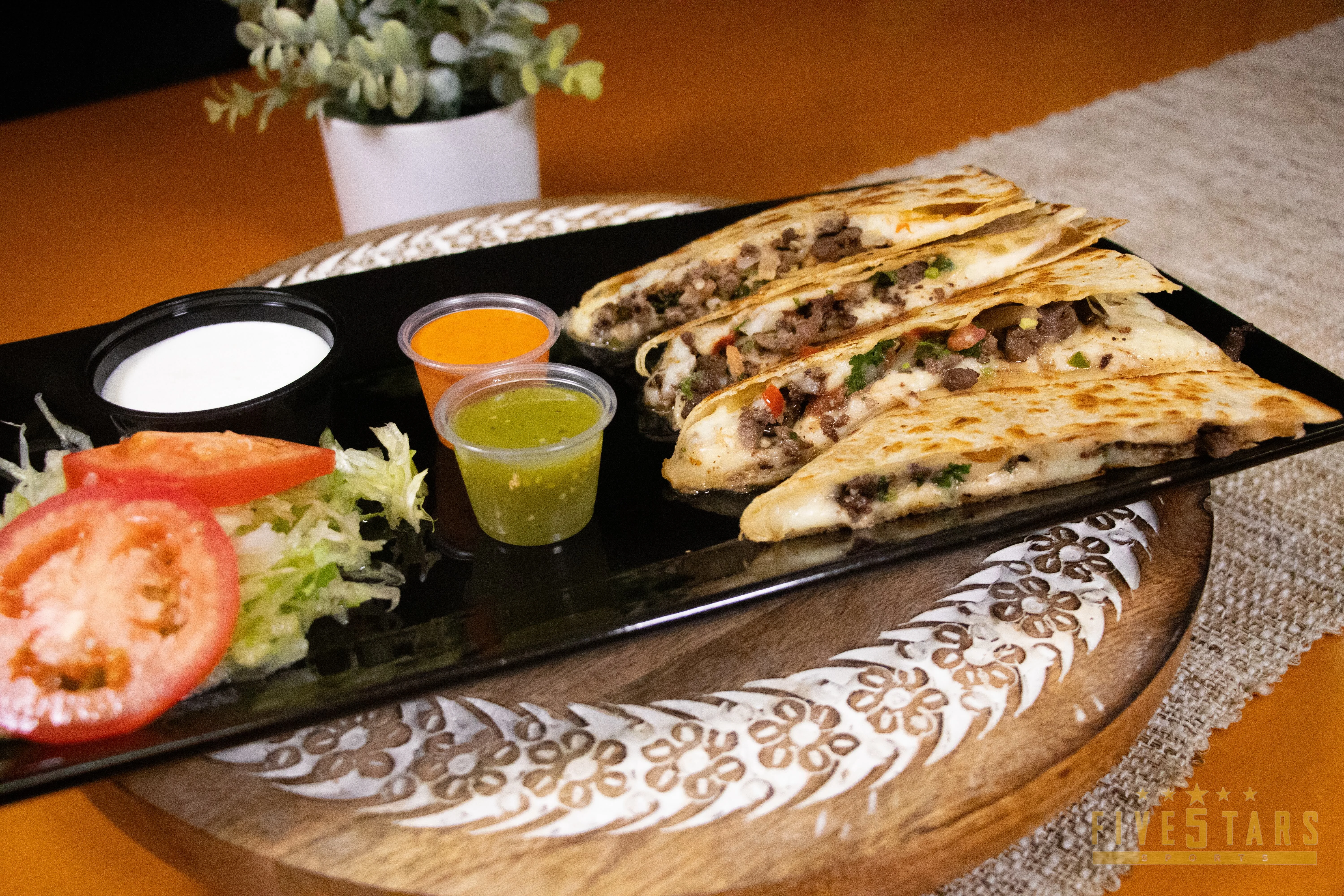 Delicious Mexican quesadillas with beef and fresh toppings