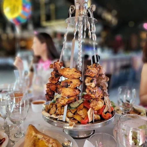 Middle Eastern mixed grill platter with skewered meats
