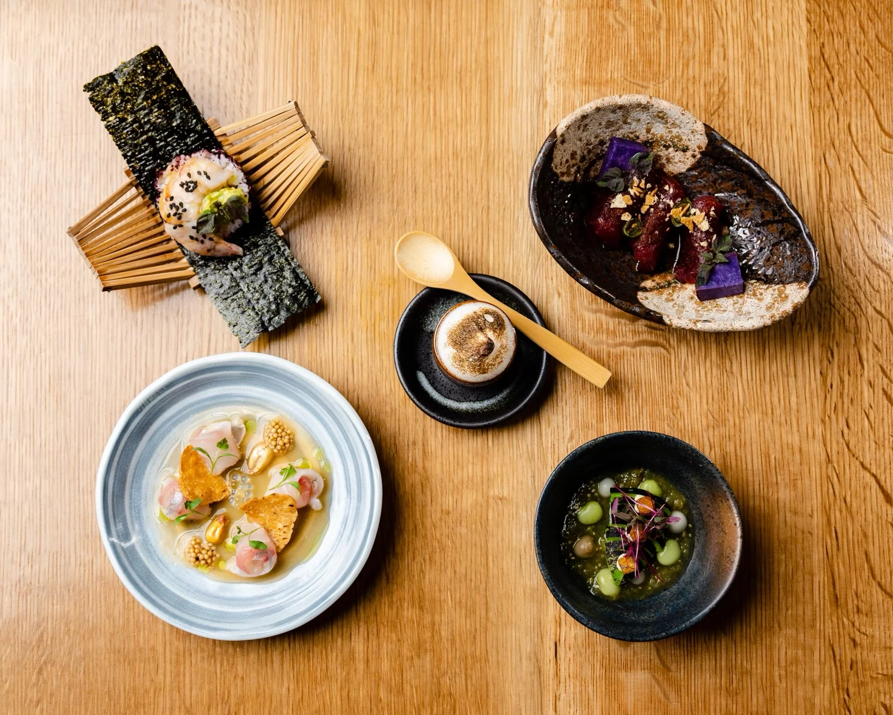 Artistic Japanese kaiseki presentation with various dishes