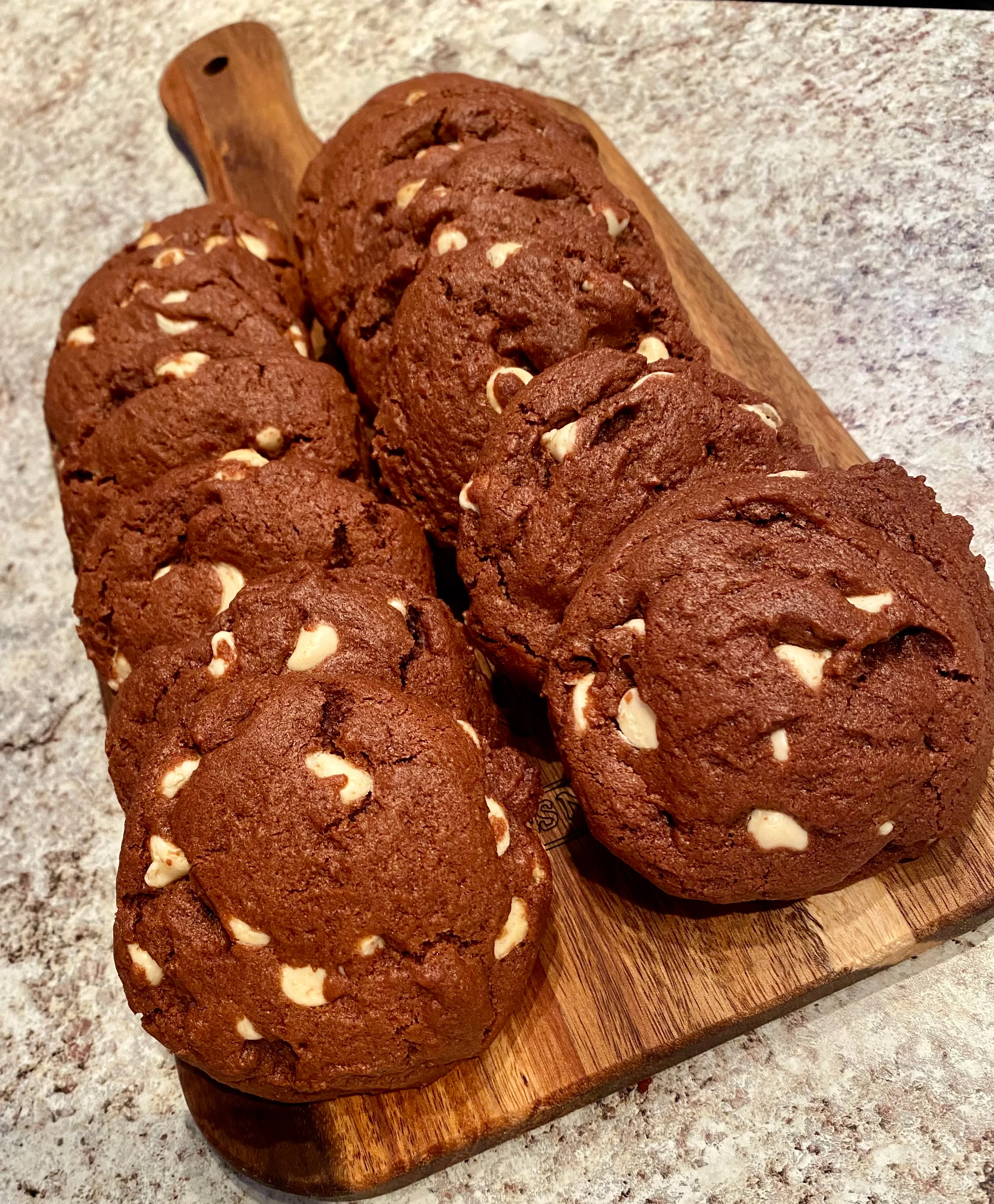 Chocolate chip cookies with white chocolate chunks on a wooden board