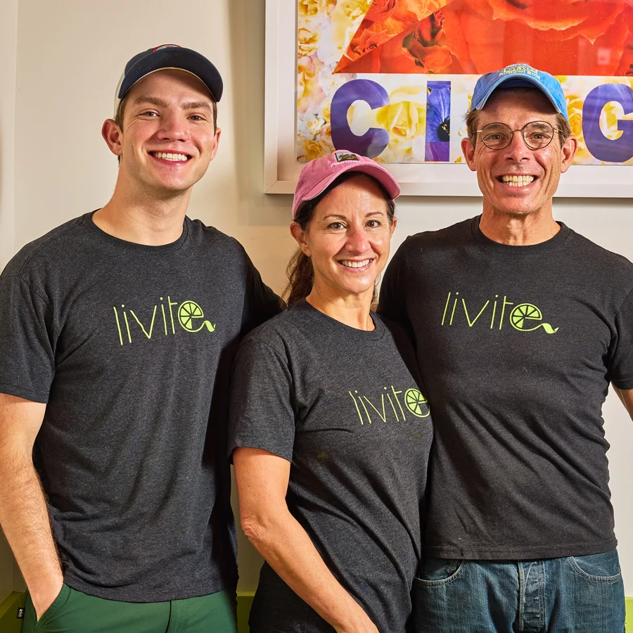 Team members of a vibrant restaurant smiling together