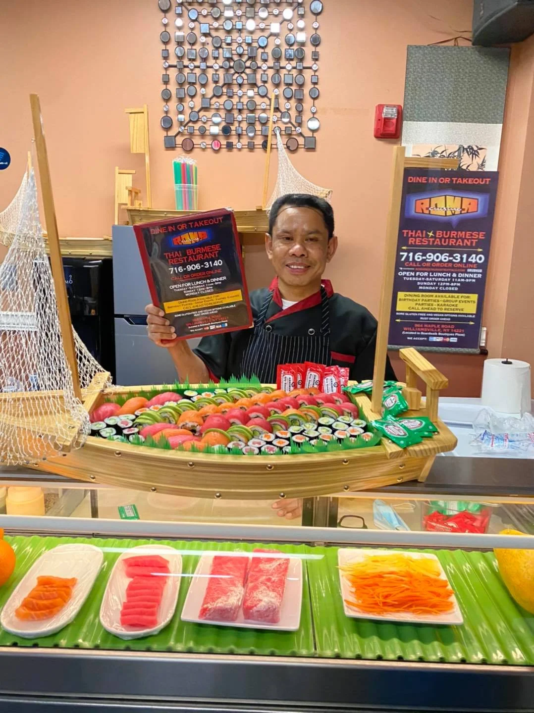 Roma Thai chef with sushi boat