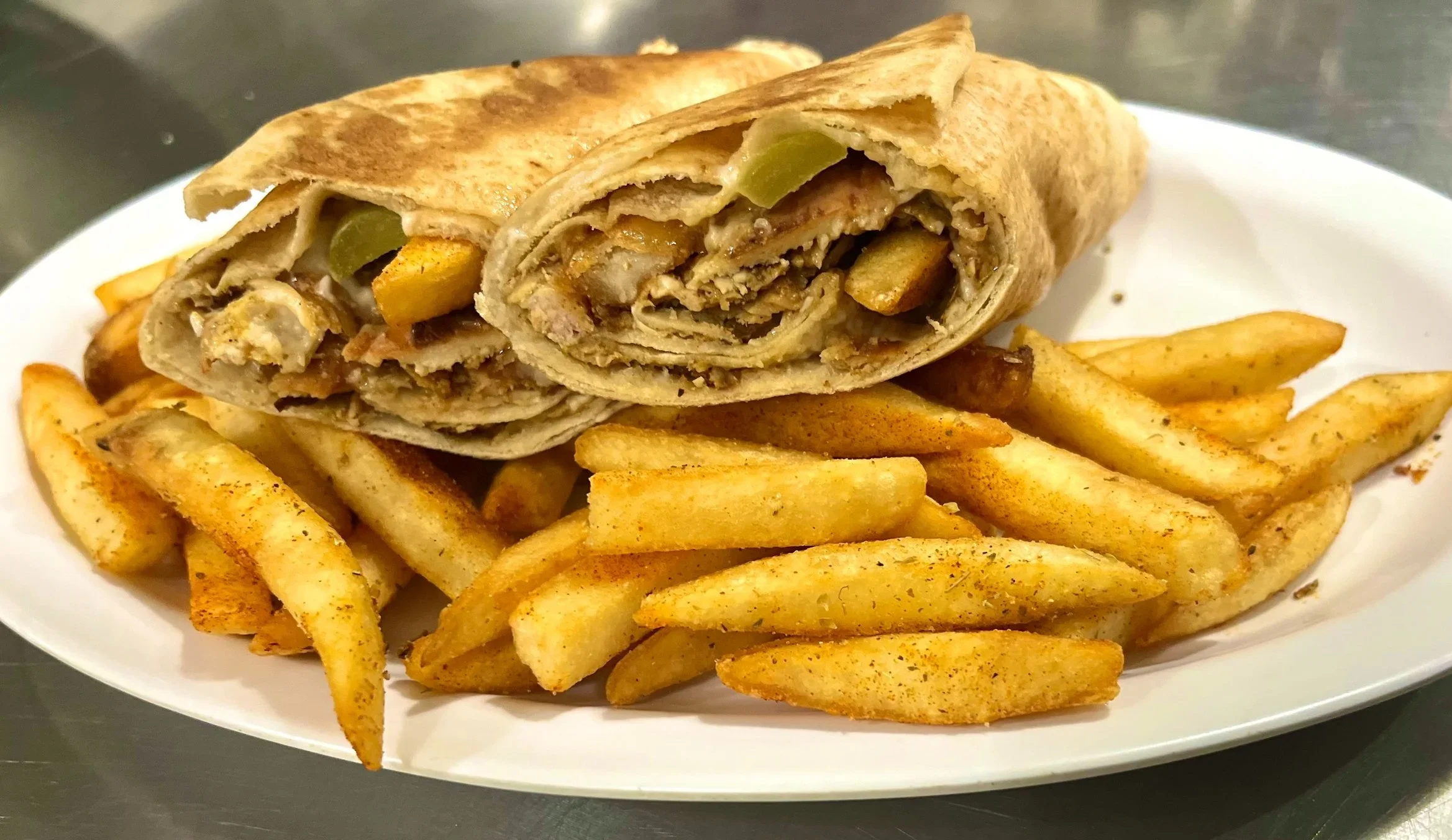 Delicious chicken wrap with fries, a popular fast food dish