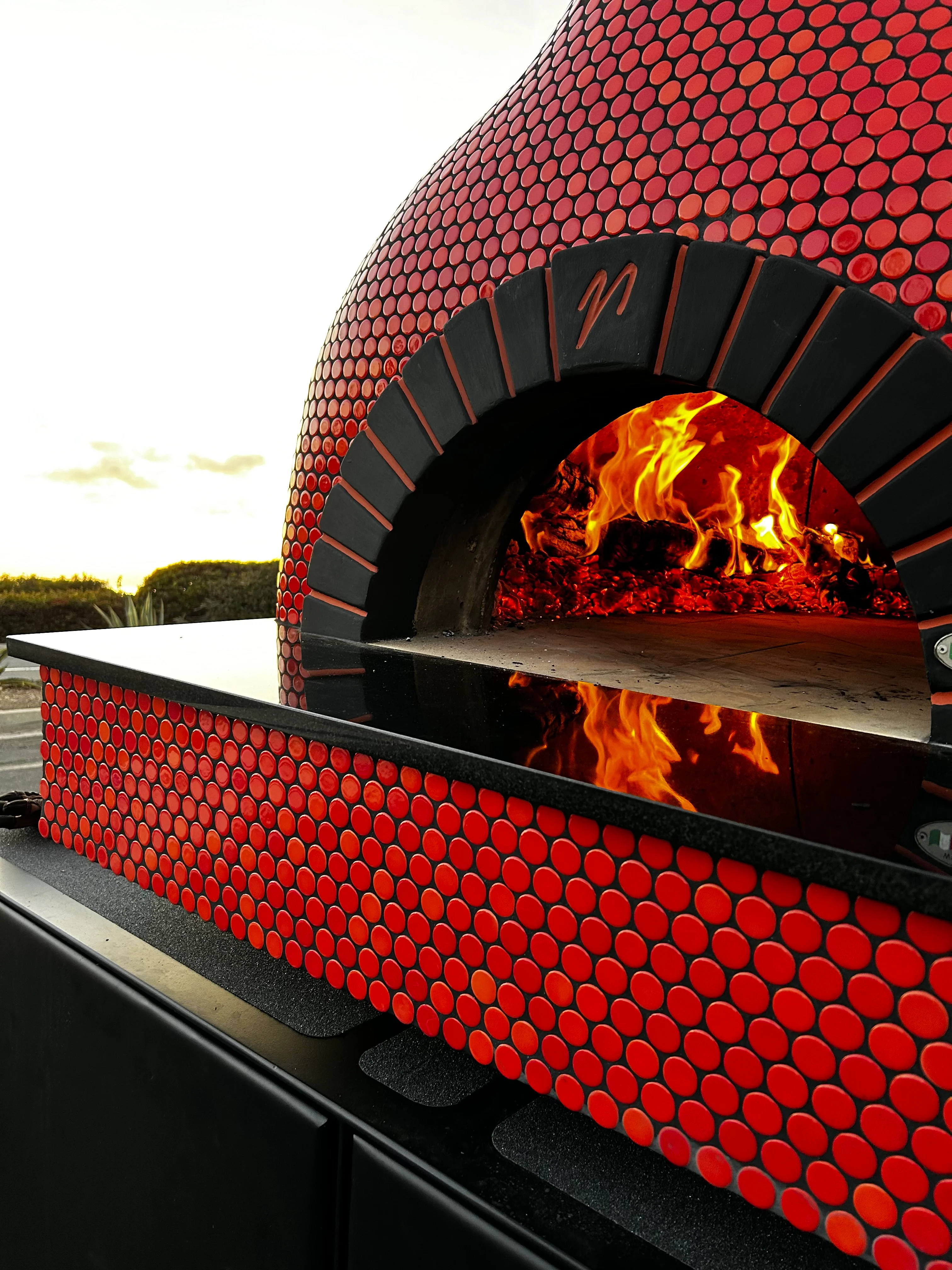 A pizza oven on fire