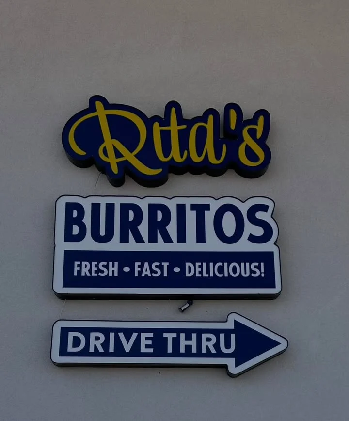 A soft tortilla filled with cooked meat, topped with cheese and jalapeños.