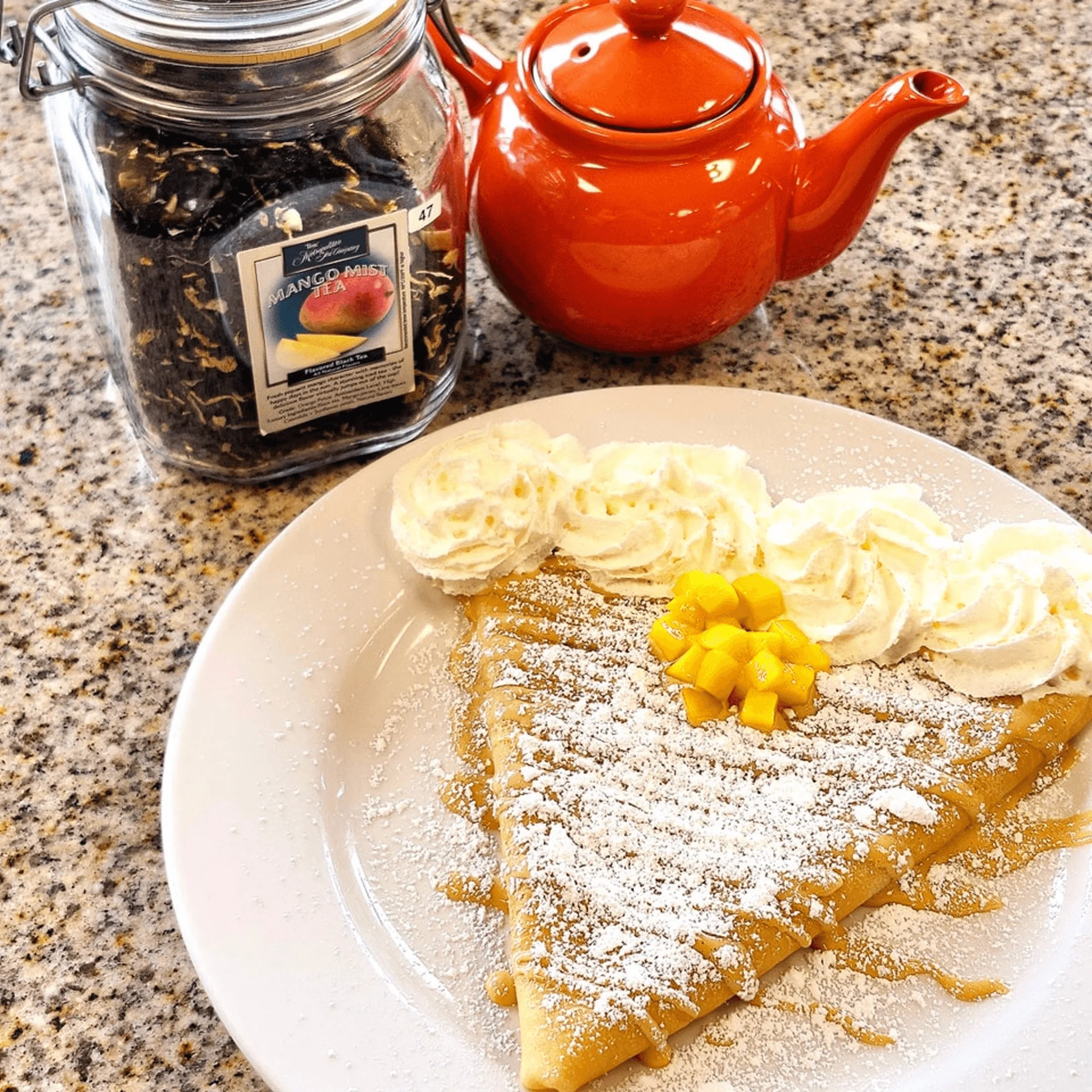 Delicious French crepe with whipped cream and mango